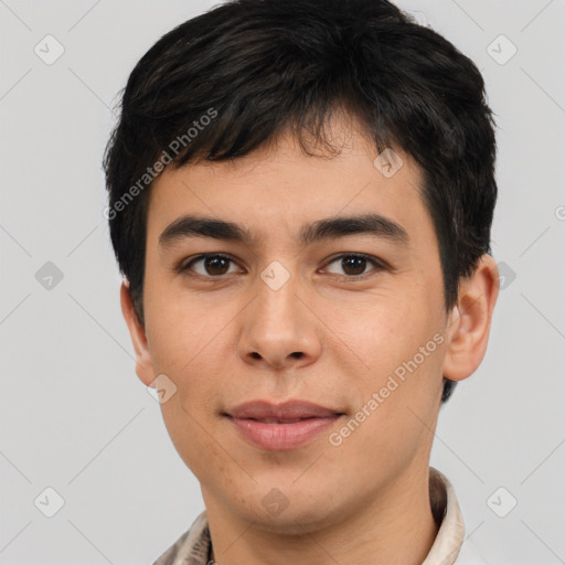 Joyful white young-adult male with short  black hair and brown eyes