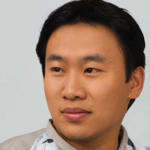 Neutral asian young-adult male with short  black hair and brown eyes