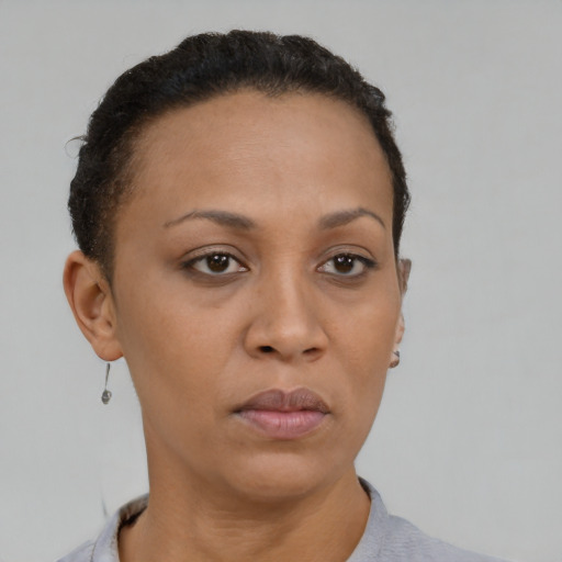 Neutral black young-adult female with short  brown hair and brown eyes