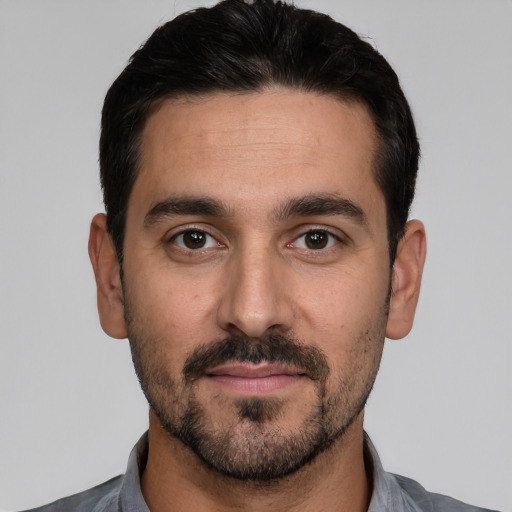 Neutral white young-adult male with short  black hair and brown eyes