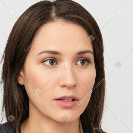 Neutral white young-adult female with long  brown hair and brown eyes