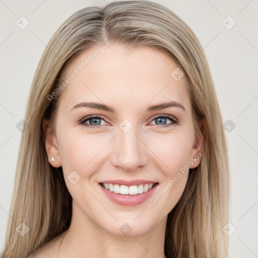 Joyful white young-adult female with long  brown hair and blue eyes