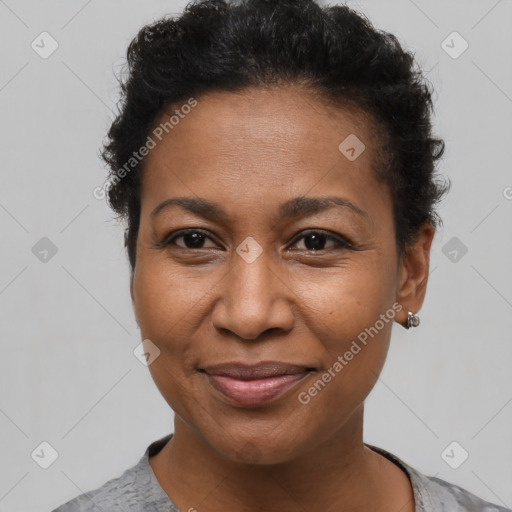 Joyful black adult female with short  brown hair and brown eyes