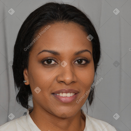 Joyful black young-adult female with medium  brown hair and brown eyes