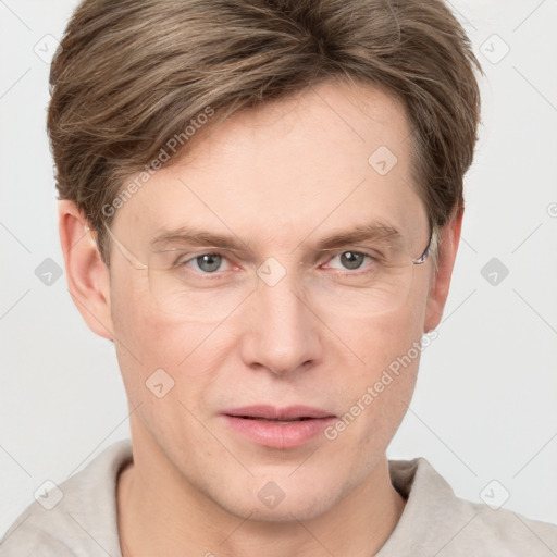 Joyful white adult male with short  brown hair and grey eyes