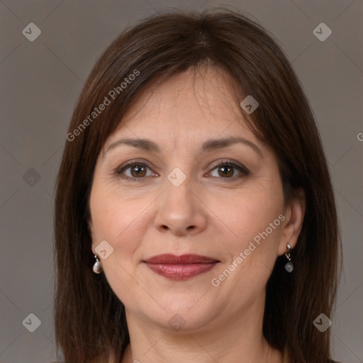 Joyful white adult female with medium  brown hair and brown eyes