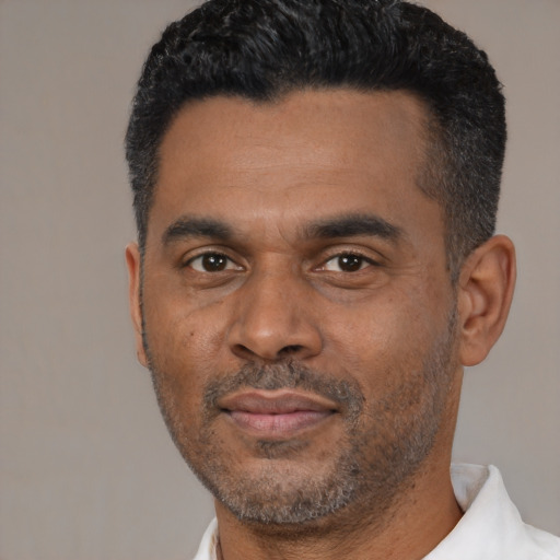 Neutral latino adult male with short  black hair and brown eyes