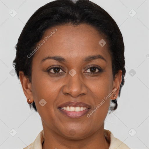 Joyful black adult female with short  brown hair and brown eyes