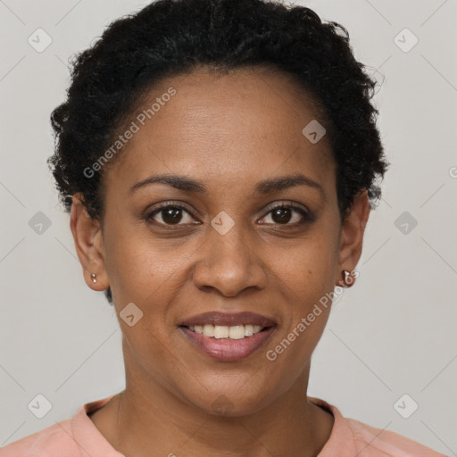 Joyful black adult female with short  brown hair and brown eyes