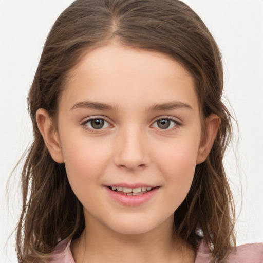 Joyful white child female with long  brown hair and brown eyes