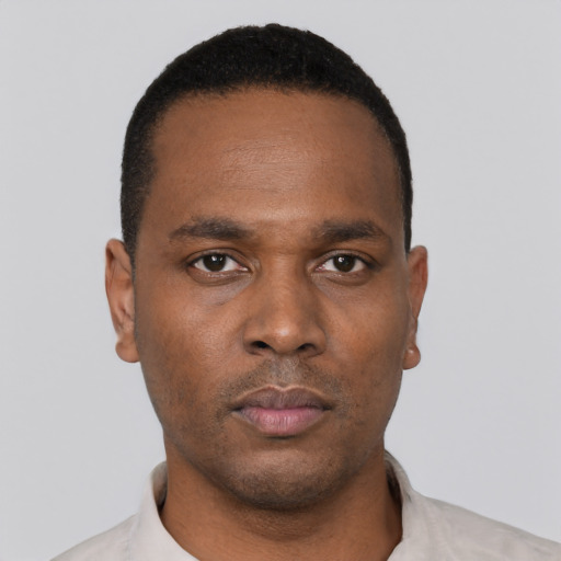 Neutral black young-adult male with short  black hair and brown eyes