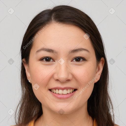 Joyful white young-adult female with long  brown hair and brown eyes