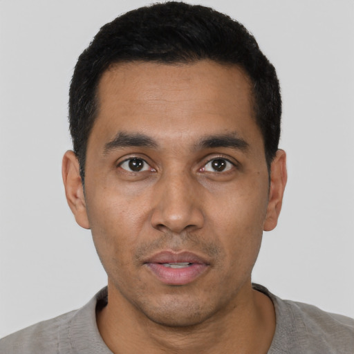 Neutral latino young-adult male with short  black hair and brown eyes
