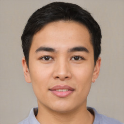 Joyful asian young-adult male with short  black hair and brown eyes