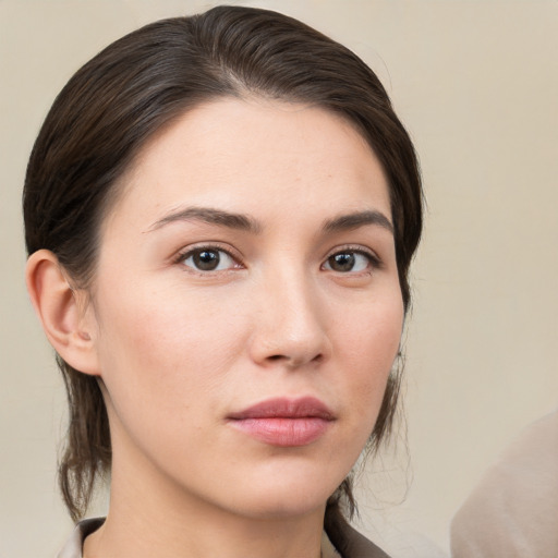 Neutral white young-adult female with medium  brown hair and brown eyes