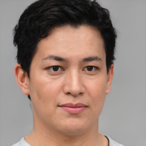 Joyful asian adult female with short  brown hair and brown eyes