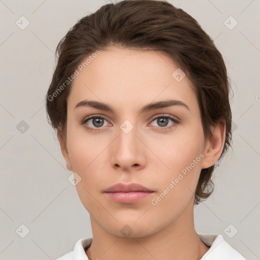 Neutral white young-adult female with short  brown hair and brown eyes