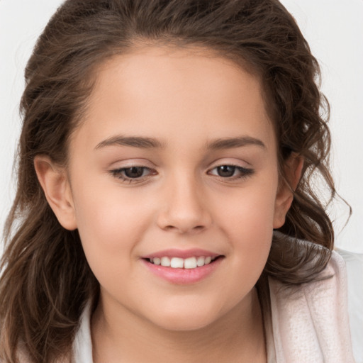 Joyful white child female with long  brown hair and brown eyes