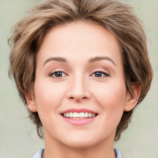 Joyful white young-adult female with medium  brown hair and green eyes