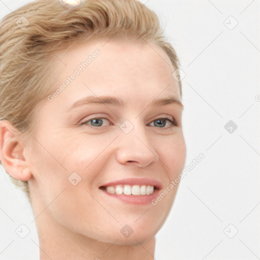 Joyful white young-adult female with short  brown hair and blue eyes