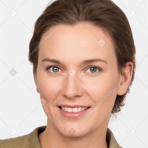 Joyful white young-adult female with medium  brown hair and grey eyes