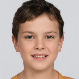 Joyful white child male with short  brown hair and brown eyes