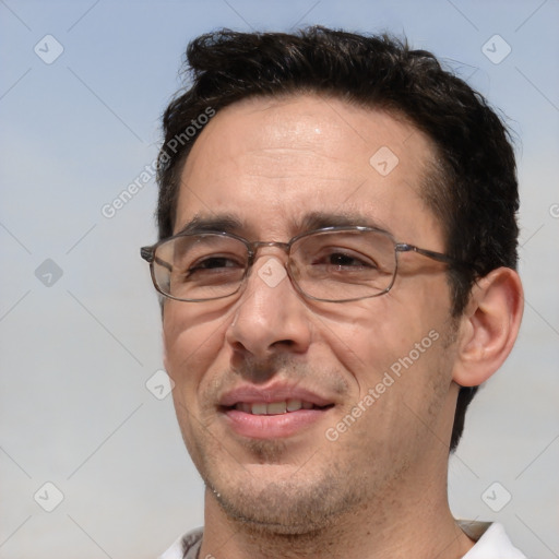 Joyful white adult male with short  brown hair and brown eyes