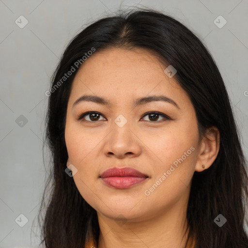 Joyful asian young-adult female with long  brown hair and brown eyes