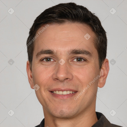 Joyful white adult male with short  brown hair and brown eyes