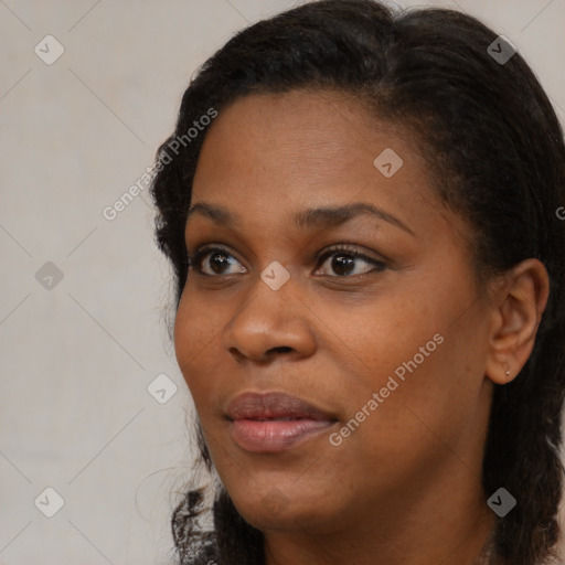 Neutral black young-adult female with medium  brown hair and brown eyes