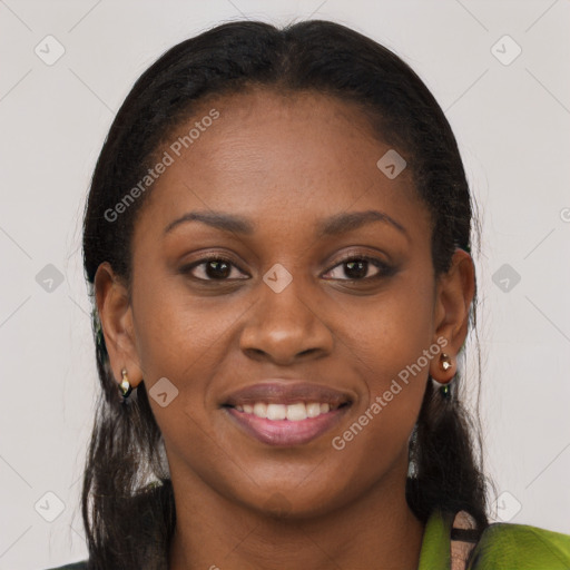 Joyful black young-adult female with long  brown hair and brown eyes