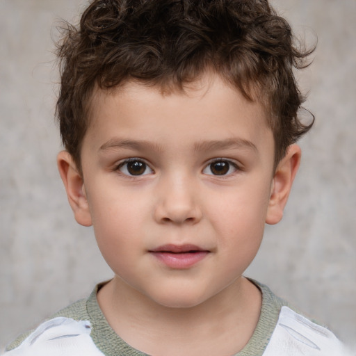 Joyful white child male with short  brown hair and brown eyes