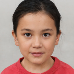 Joyful white child female with short  brown hair and brown eyes