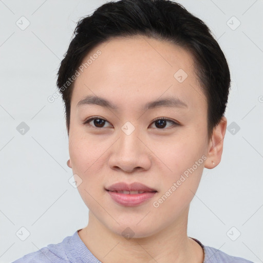 Joyful asian young-adult female with short  brown hair and brown eyes