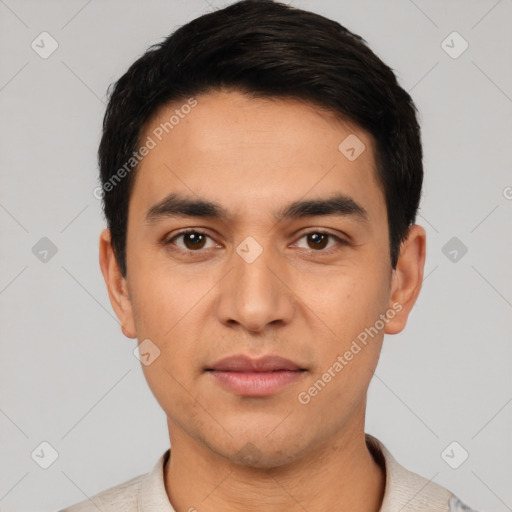 Joyful latino young-adult male with short  black hair and brown eyes