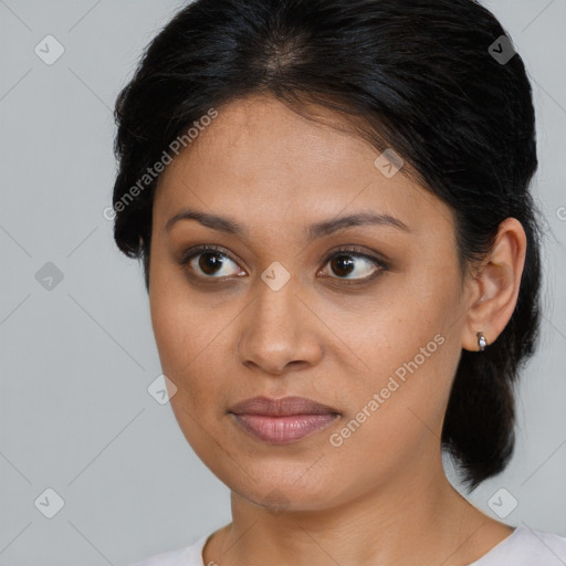 Joyful latino young-adult female with medium  brown hair and brown eyes