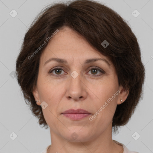 Joyful white adult female with medium  brown hair and brown eyes