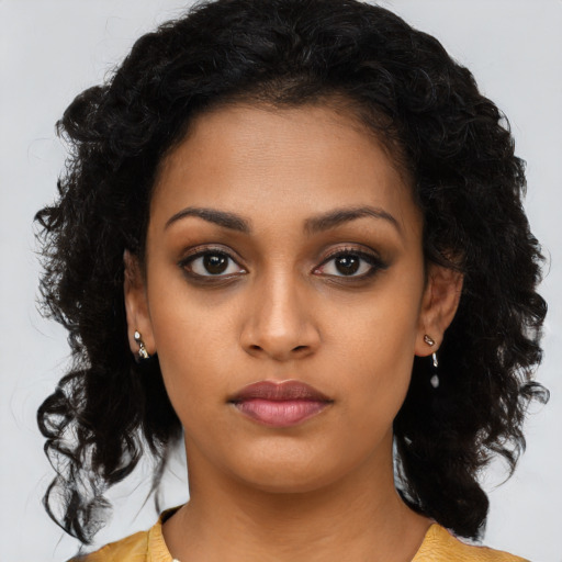 Neutral black young-adult female with long  brown hair and brown eyes