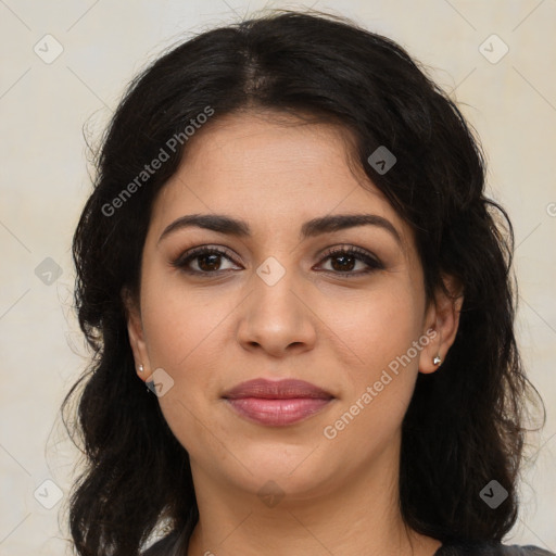 Joyful latino young-adult female with long  brown hair and brown eyes