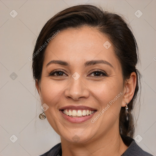 Joyful white adult female with medium  brown hair and brown eyes