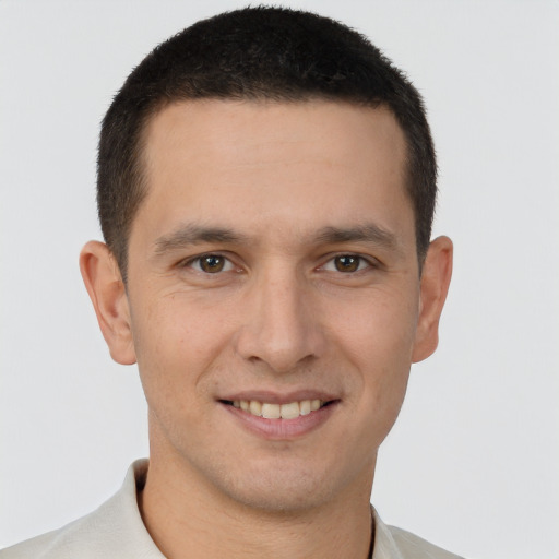 Joyful white young-adult male with short  brown hair and brown eyes