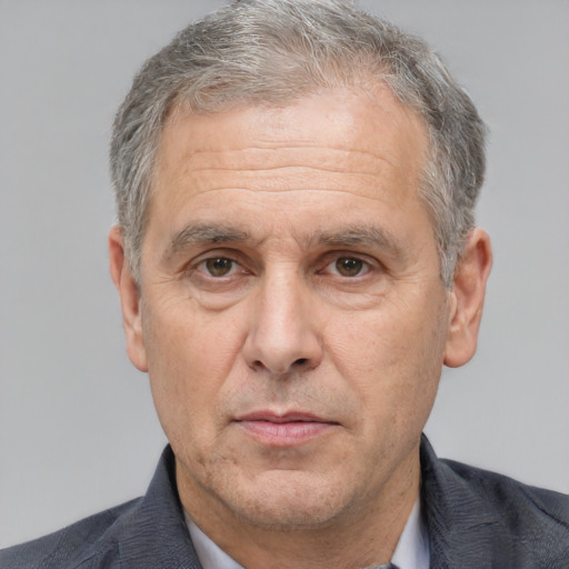 Neutral white middle-aged male with short  gray hair and brown eyes