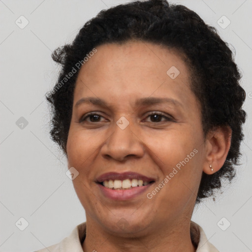 Joyful latino adult female with short  brown hair and brown eyes