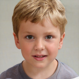 Joyful white child male with short  brown hair and brown eyes