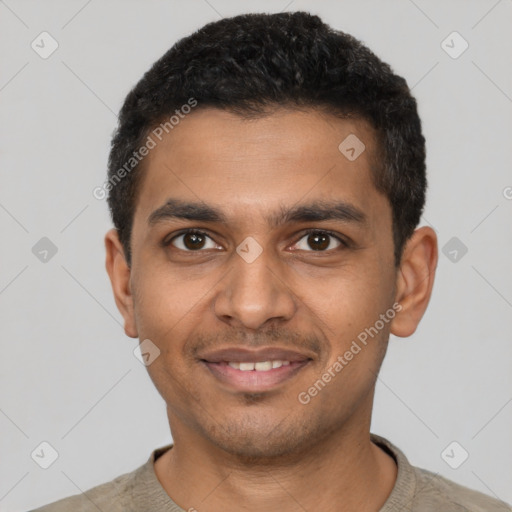 Joyful latino young-adult male with short  black hair and brown eyes