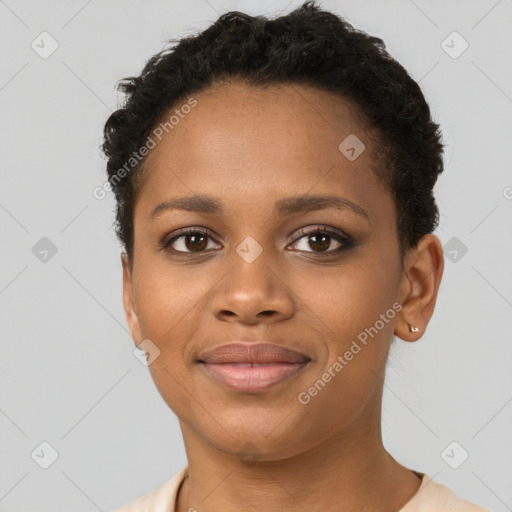 Joyful black young-adult female with short  brown hair and brown eyes