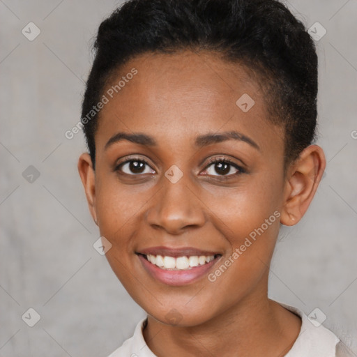 Joyful black young-adult female with short  brown hair and brown eyes