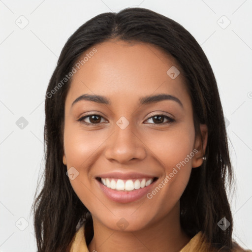 Joyful latino young-adult female with long  brown hair and brown eyes