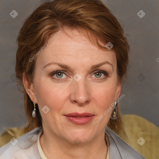 Joyful white adult female with medium  brown hair and blue eyes