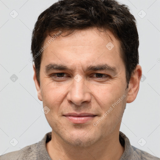 Joyful white adult male with short  brown hair and grey eyes